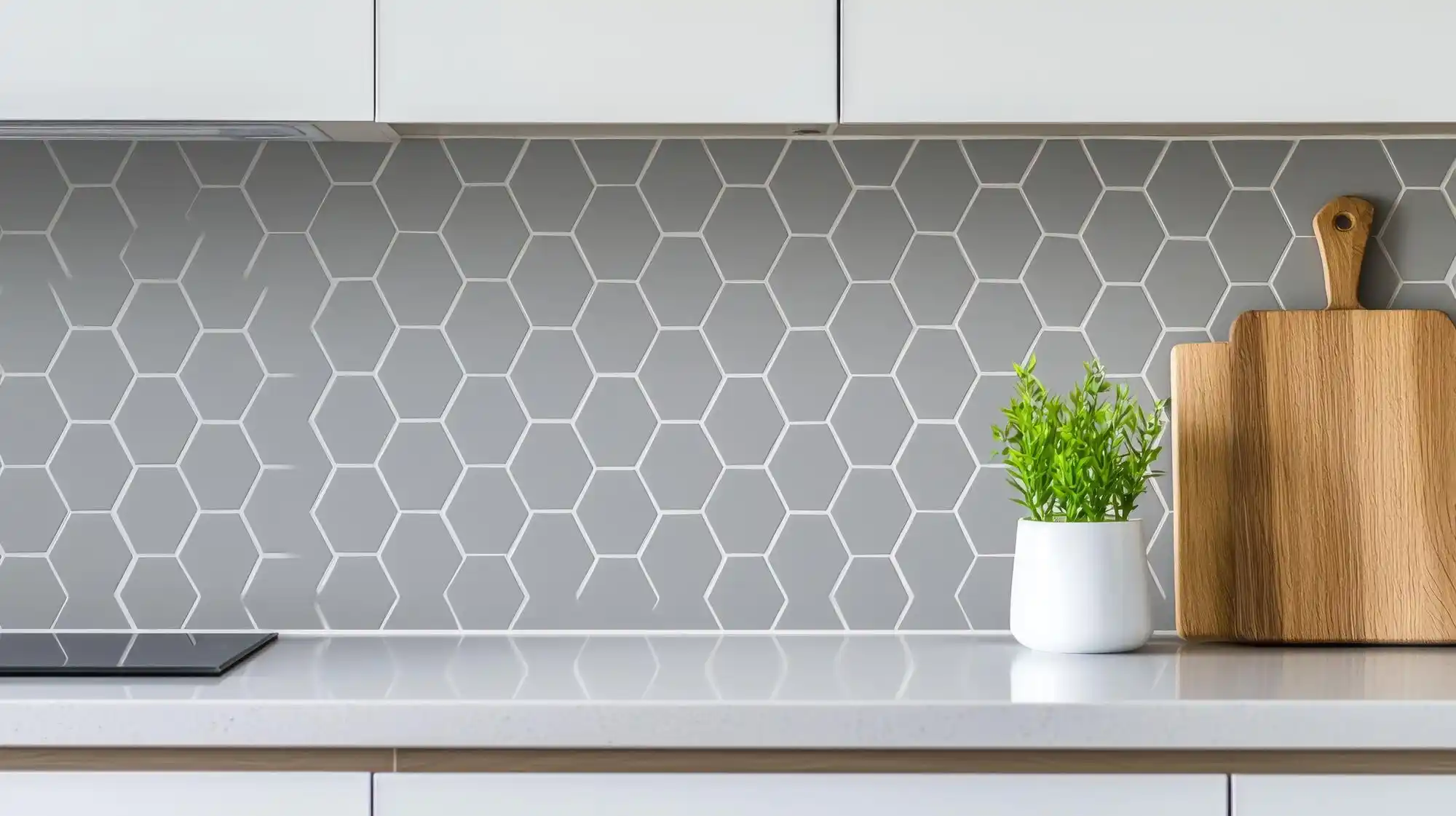cost-conscious contemporary kitchen with refinished navy cabinets, butcher block accent section, white quartz counters, subway tile backsplash, and budget-friendly brass lighting