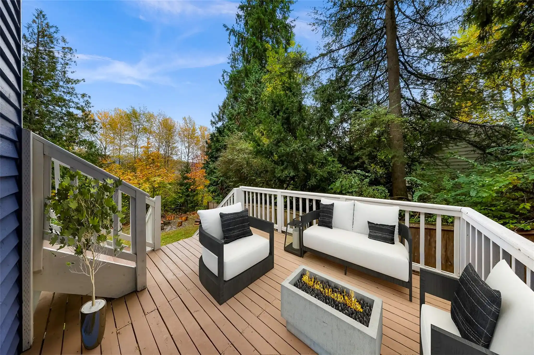 Seattle craftsman home exterior with fresh paint, updated landscaping, black front door, and soft overcast natural light on a quiet residential street