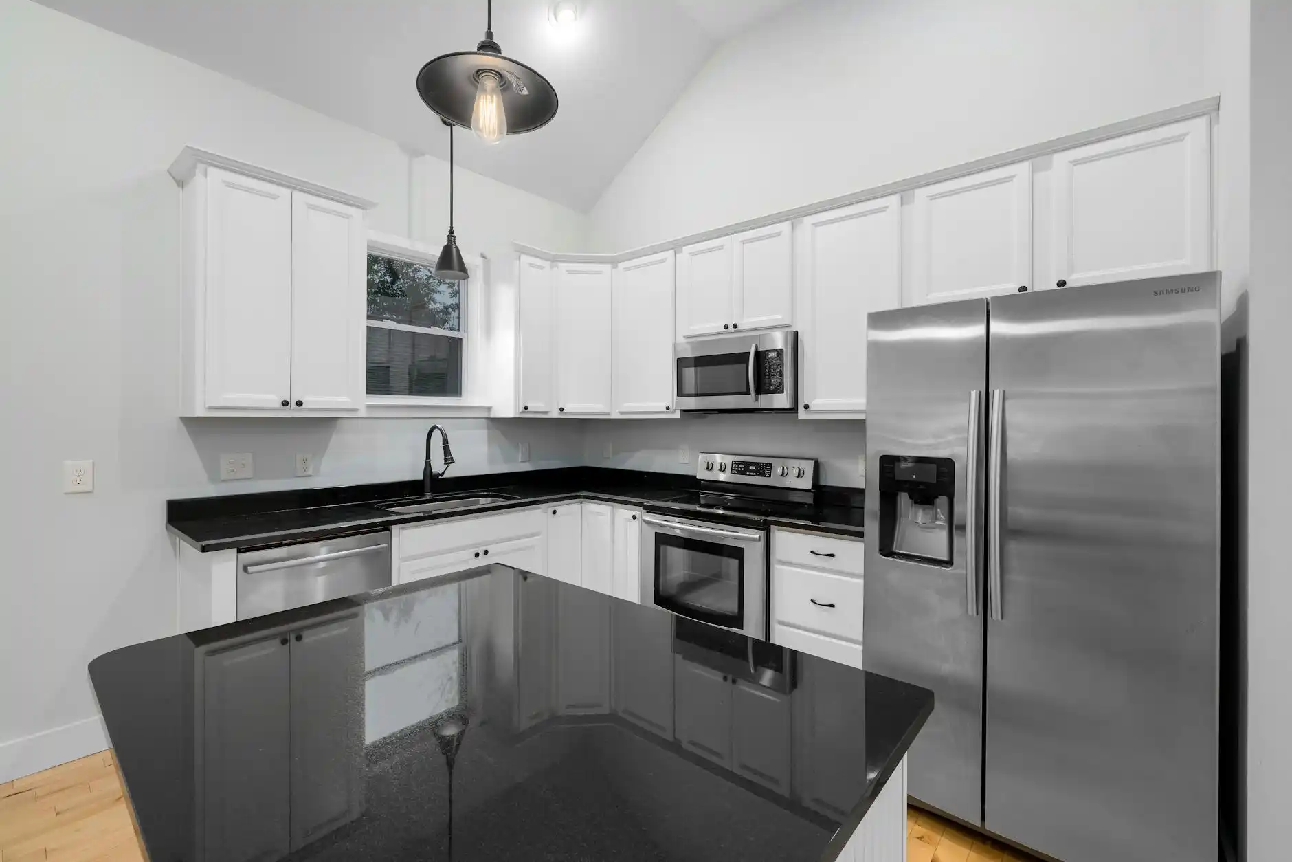 cozy budget-friendly kitchen makeover with painted shaker cabinets, butcher block counters, matte black hardware, and warm natural light in a suburban family home