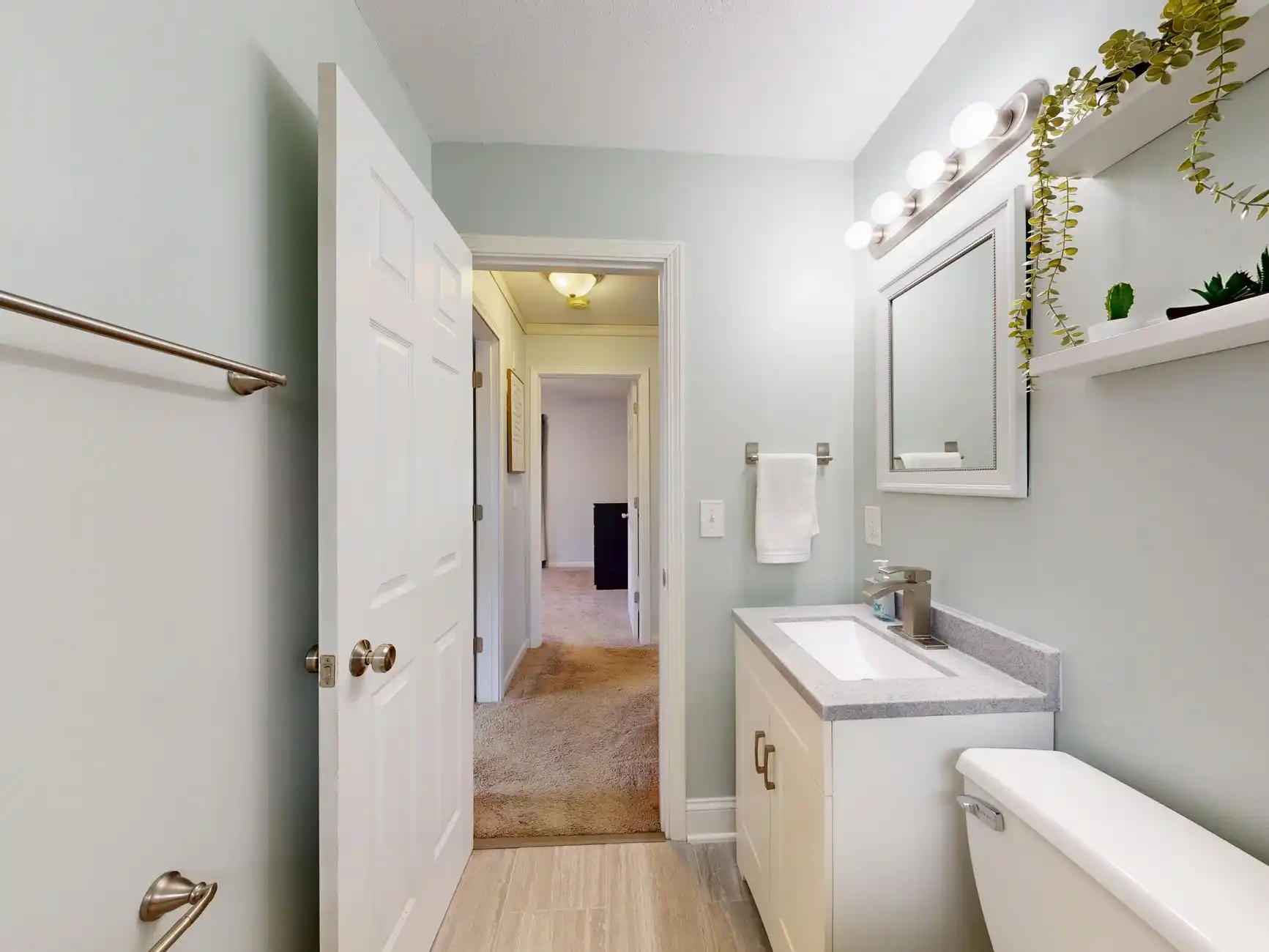 side-by-side comparison of a cluttered cramped bathroom and a remodeled bright compact bathroom with improved storage, larger mirror, and cleaner layout