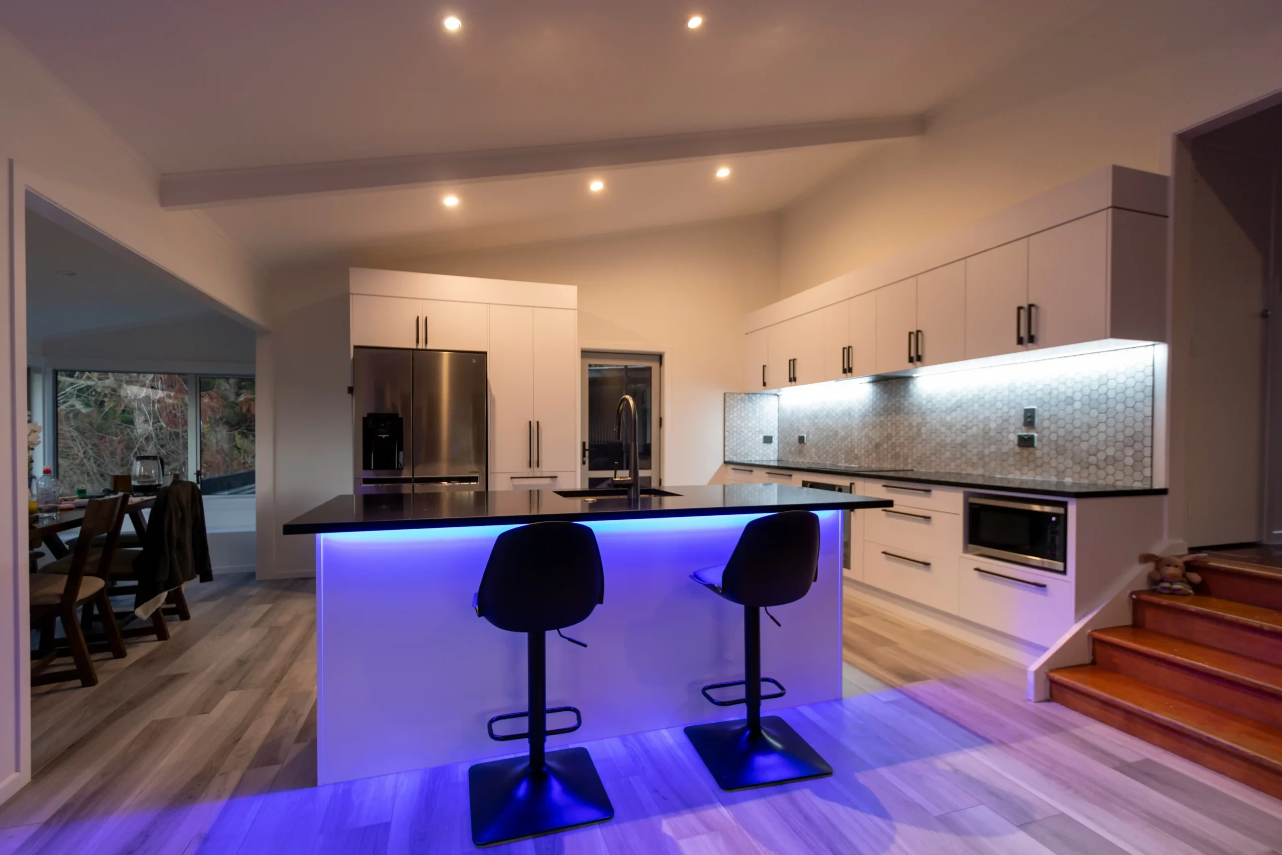 side-by-side before-and-after home remodel boards showing kitchen transformation, structural wall removal, improved lighting, and labeled design notes
