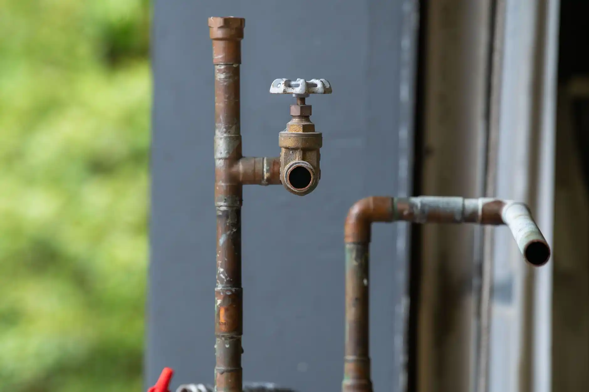 Editorial photograph illustrating "Water Service: The DADU Usually Does Not Mean a Second City Water Service" in the context of ADU utility connections, natural daylight, realis...