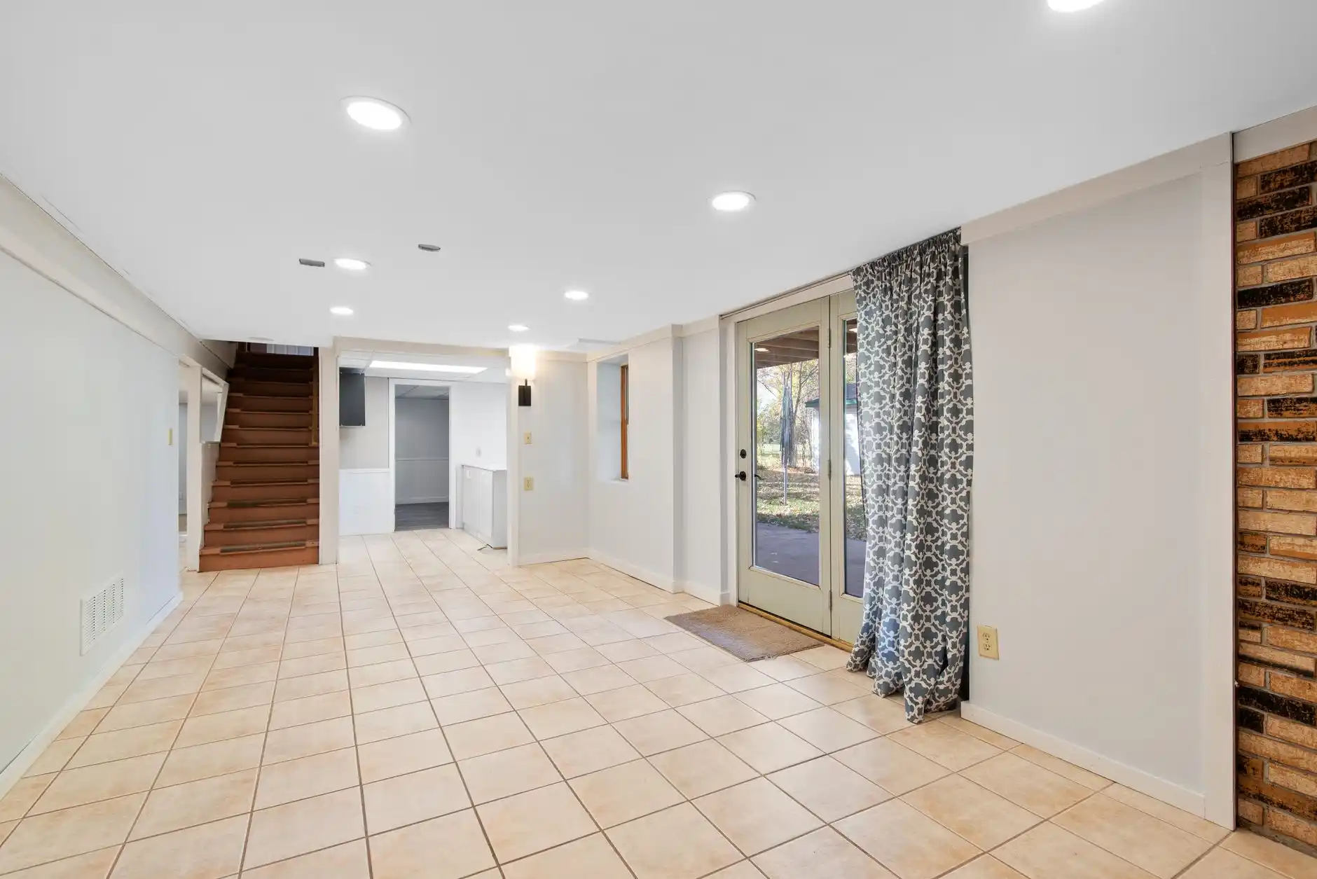 Editorial photograph illustrating "Step 1: Decide What the Basement Will Be" in the context of finish a basement Seattle, natural daylight, realistic setting, no text or logos i...