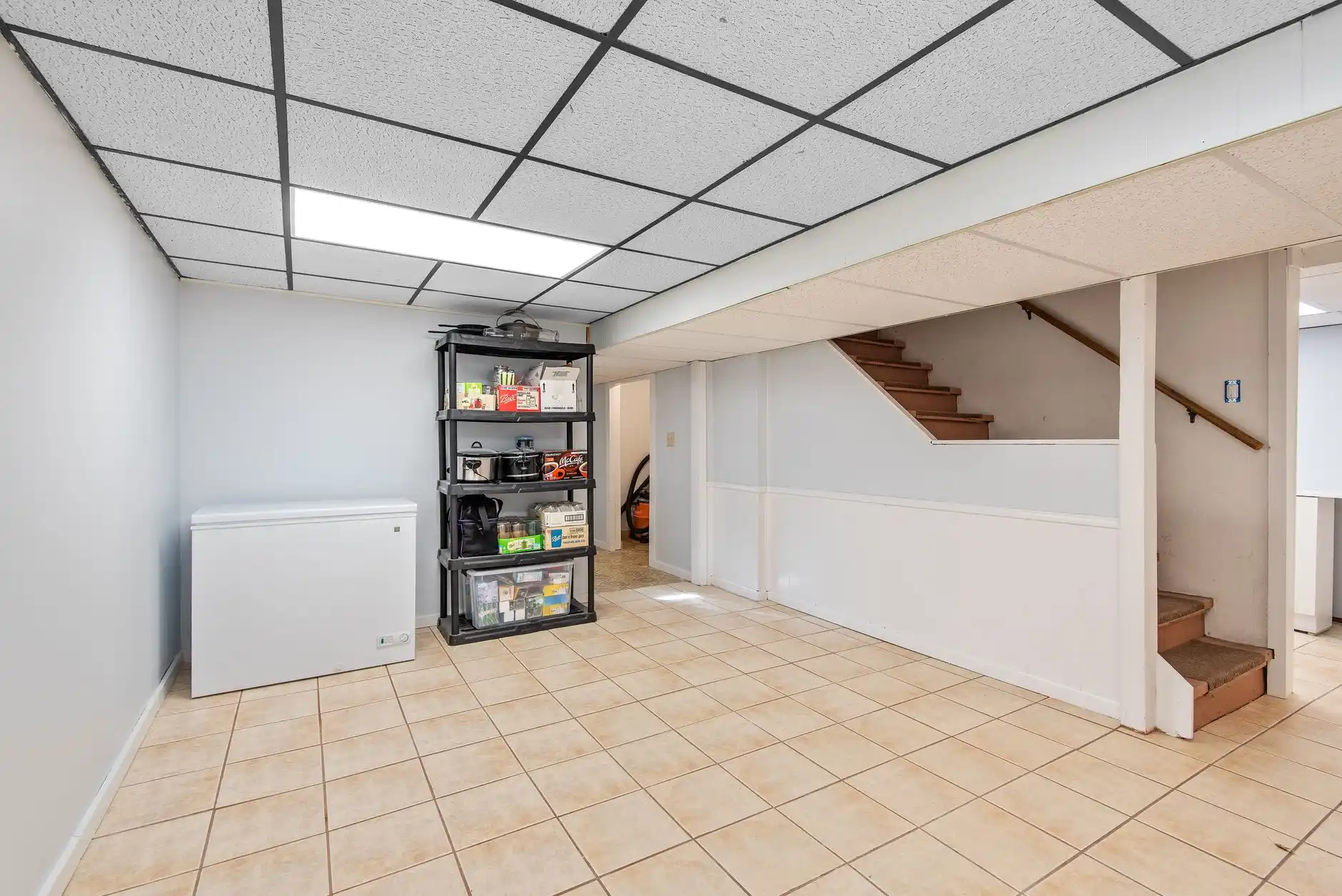 Editorial photograph illustrating "Step 5: Plan Egress Early" in the context of finish a basement Seattle, natural daylight, realistic setting, no text or logos in frame.