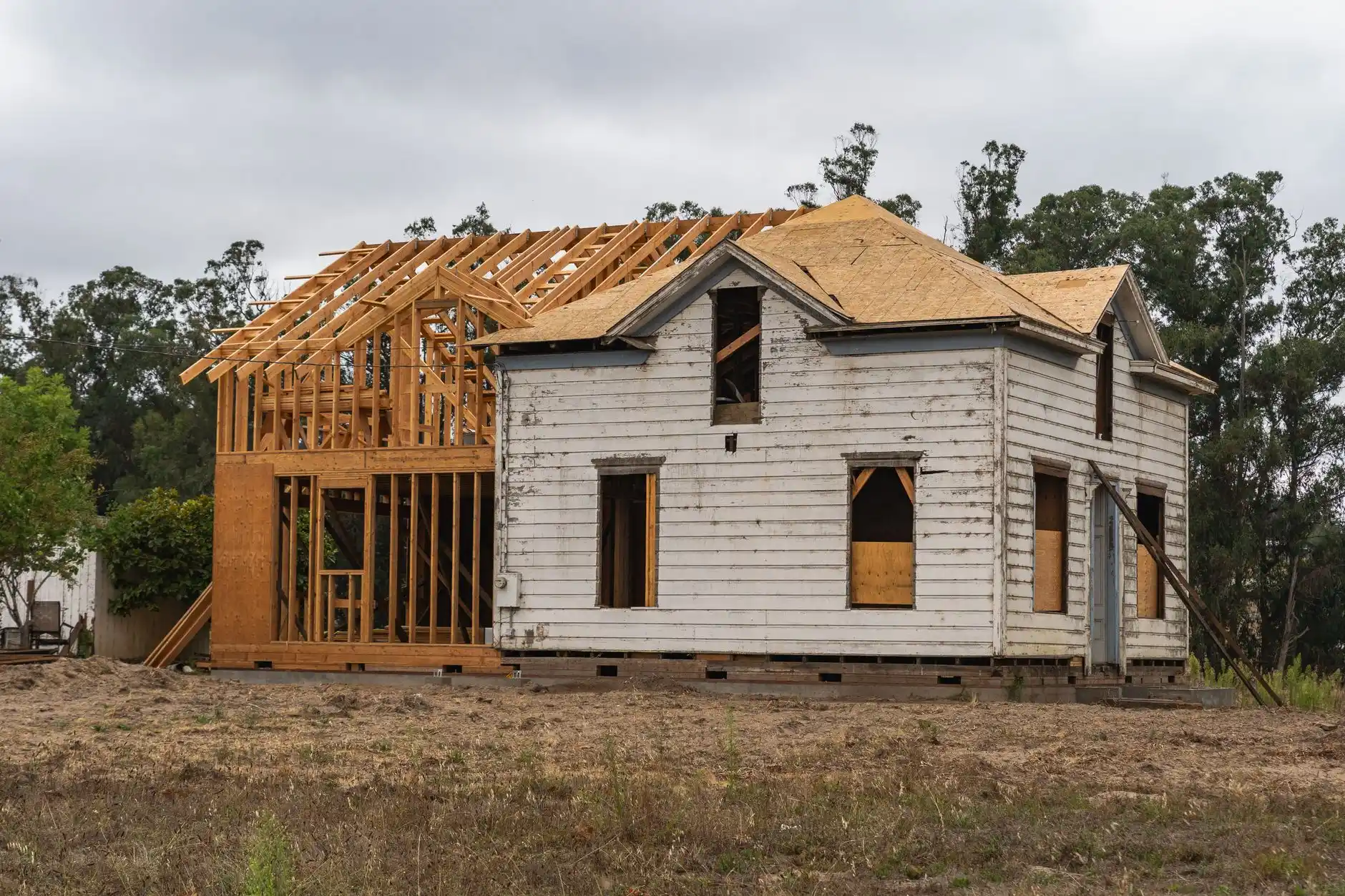 Editorial photograph illustrating "Asbestos-Containing Materials" in the context of hidden problems in older Seattle homes, natural daylight, realistic setting, no text or logos...