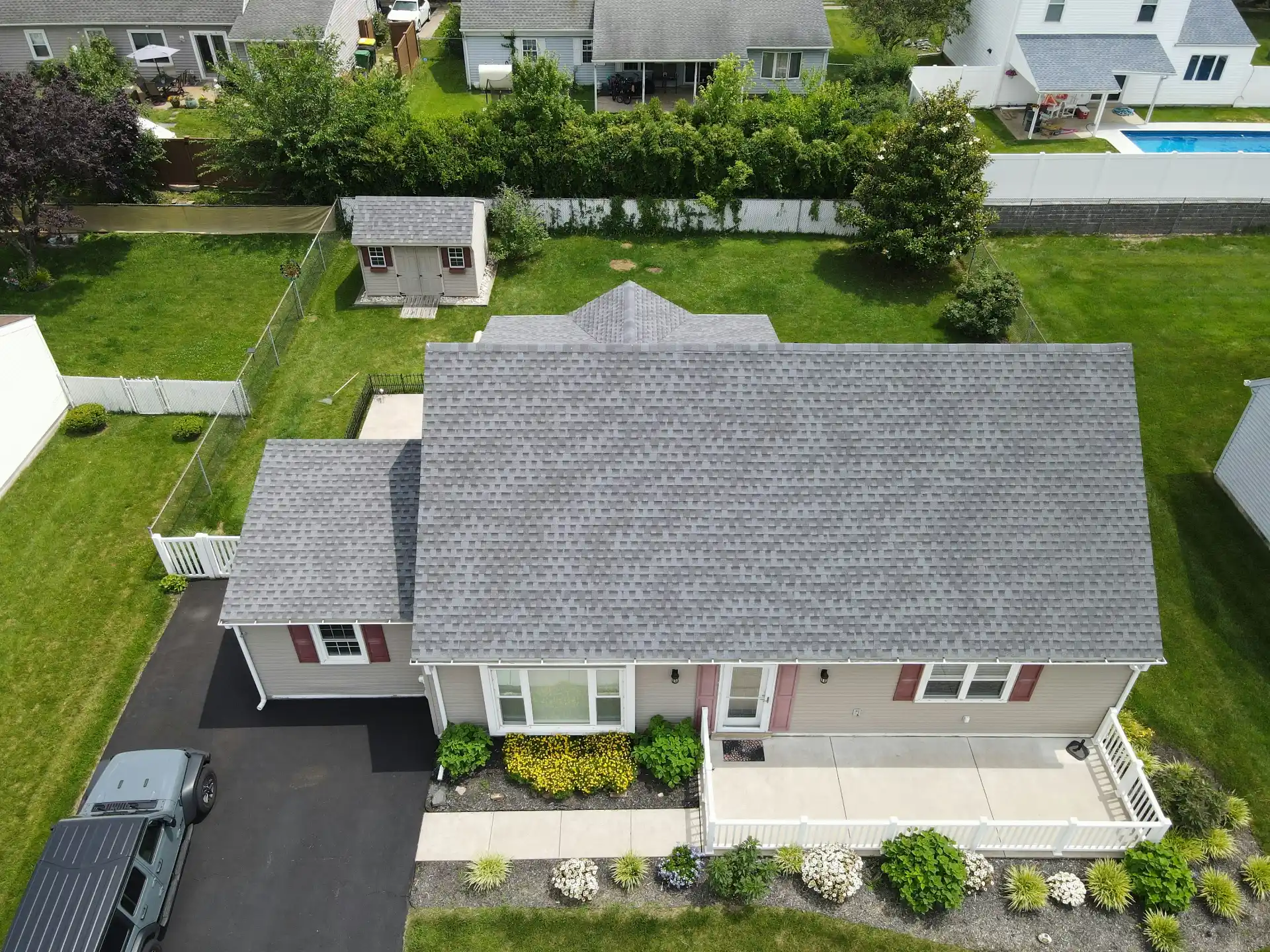 Editorial photograph illustrating "Connecting the Addition to the Existing House" in the context of home addition cost Seattle, natural daylight, realistic setting, no text or l...