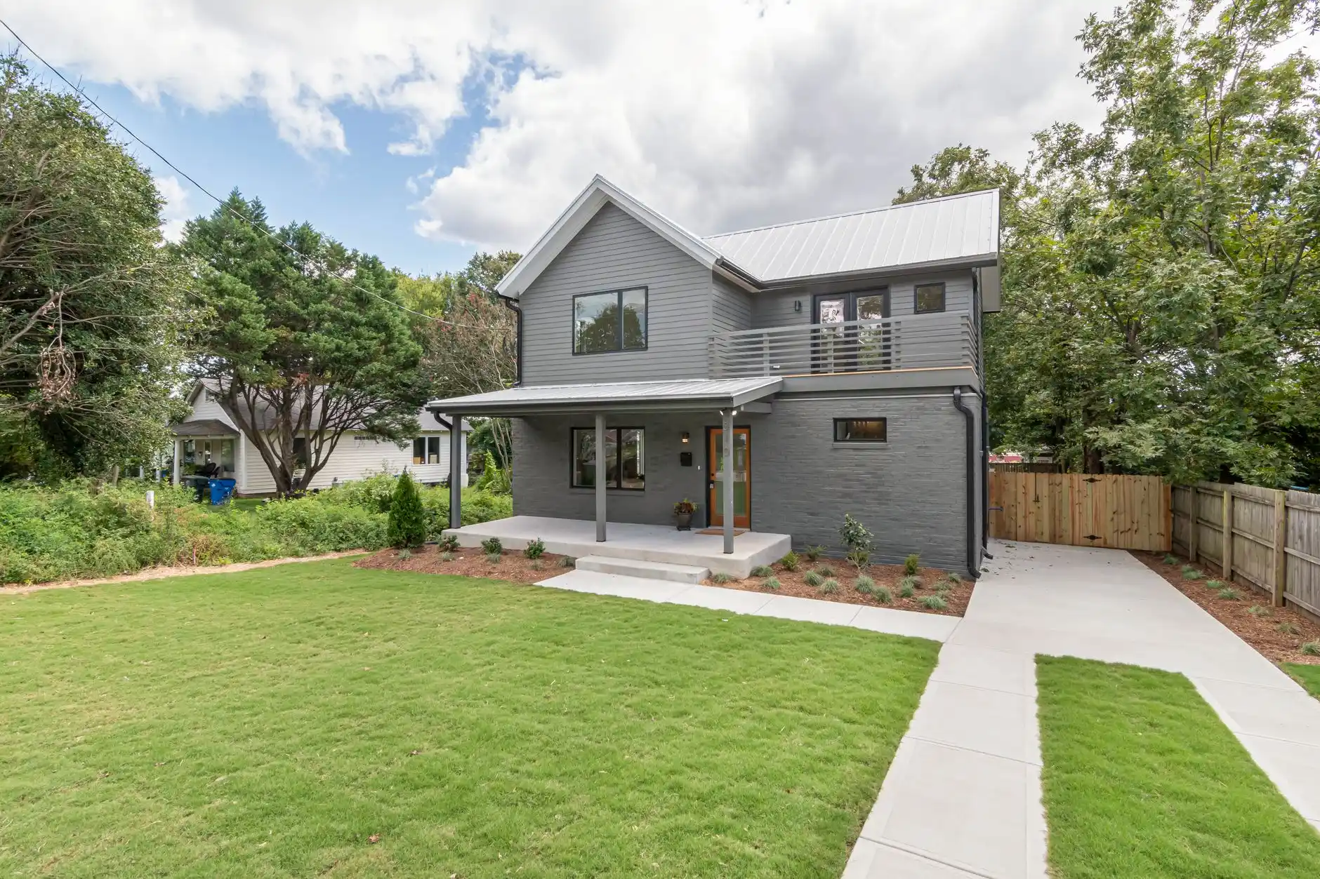 Editorial photograph illustrating "First-Floor Addition vs Second-Story Addition" in the context of home addition cost Seattle, natural daylight, realistic setting, no text or l...