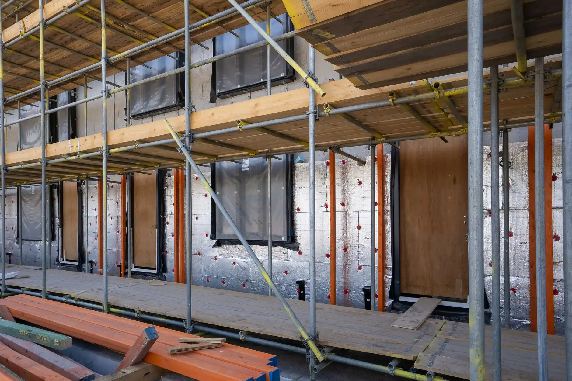 Editorial photograph illustrating "Phase 7: Insulation, Drywall, and Interior Build-Out" in the context of how long does a whole house remodel take, natural daylight, realistic ...