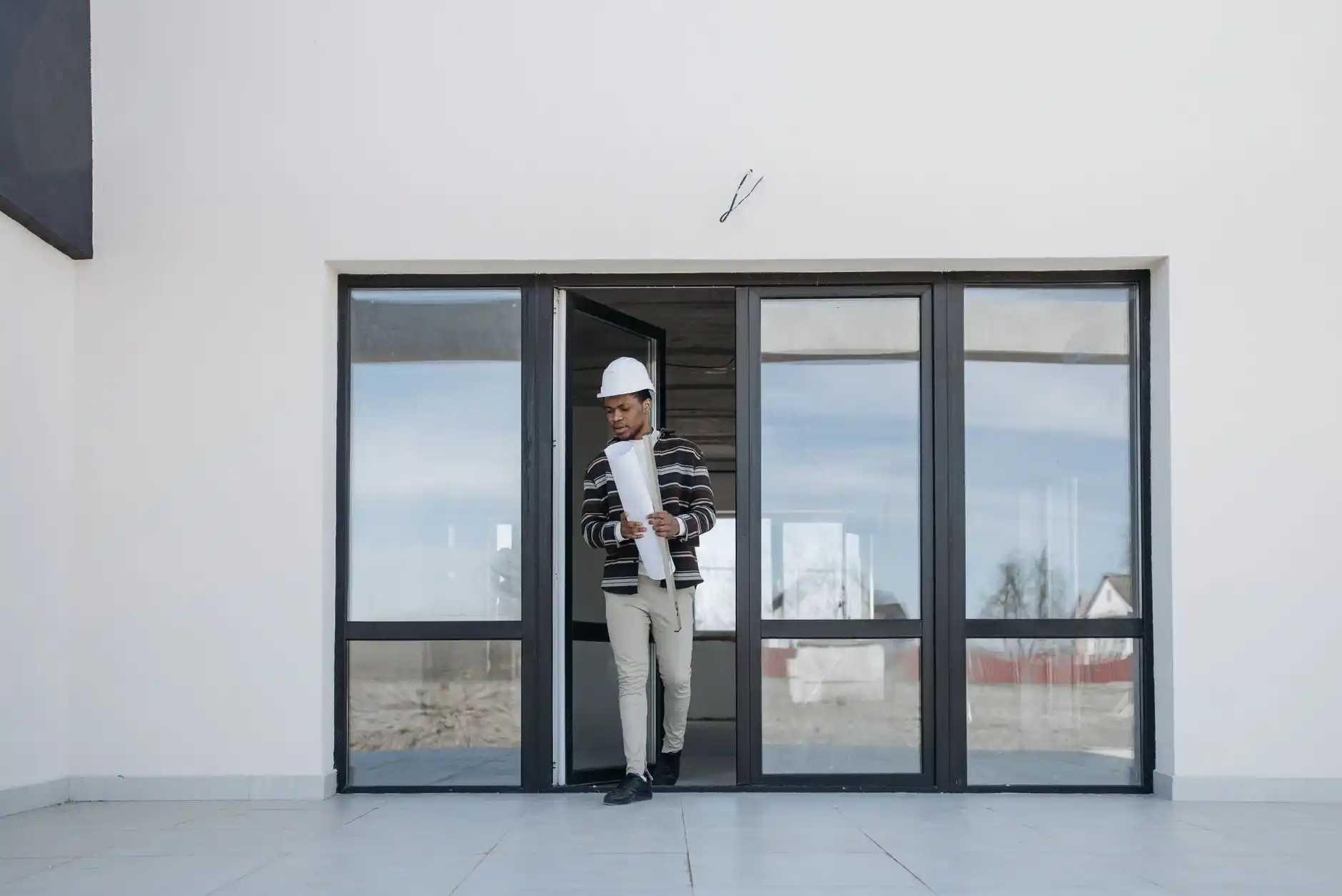 Editorial photograph illustrating "Dust Control Is a Construction Scope" in the context of live in house during remodel, natural daylight, realistic setting, no text or logos in...