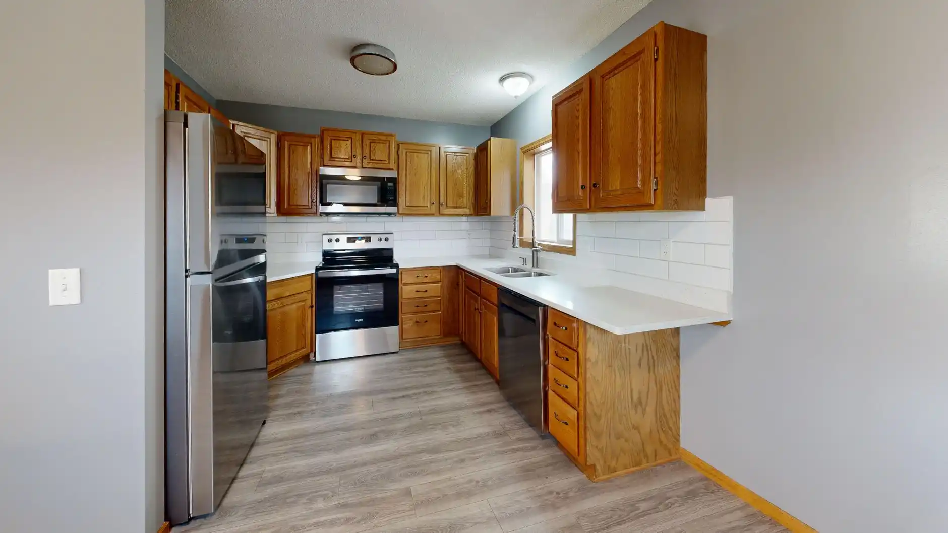 Editorial photograph illustrating "Step 11: Paint, Fixtures, Appliances, and Finish Electrical" in the context of order to renovate a house, natural daylight, realistic setting,...