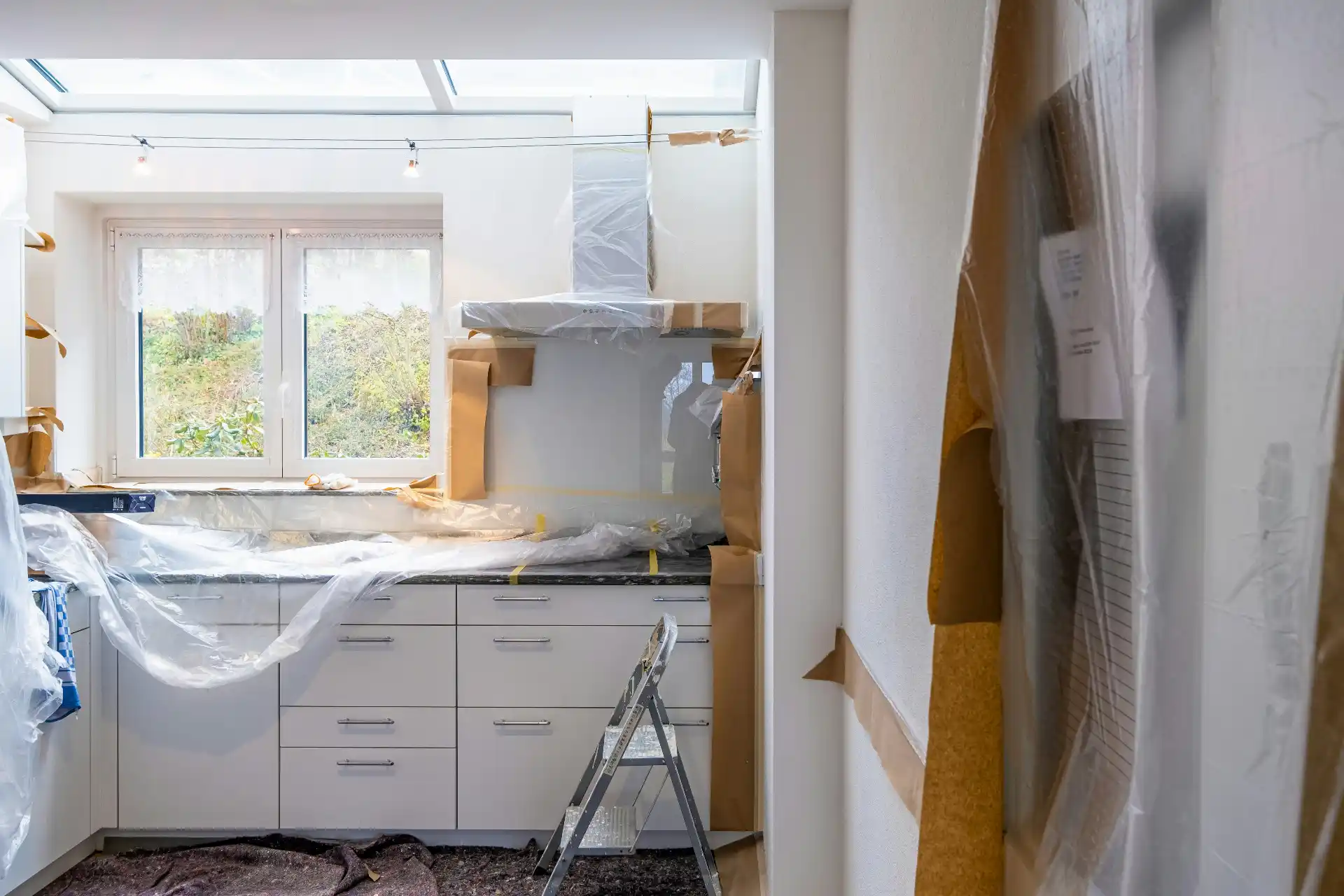 Editorial photograph illustrating "Start With the Difference Between Contingency and Allowances" in the context of remodel contingency budget, natural daylight, realistic settin...