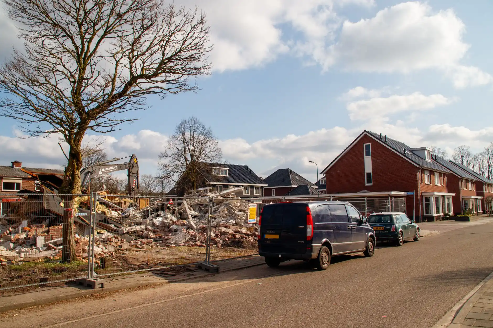 Editorial photograph illustrating "Site Conditions Do Not Disappear With Demolition" in the context of remodel vs rebuild Seattle, natural daylight, realistic setting, no text o...