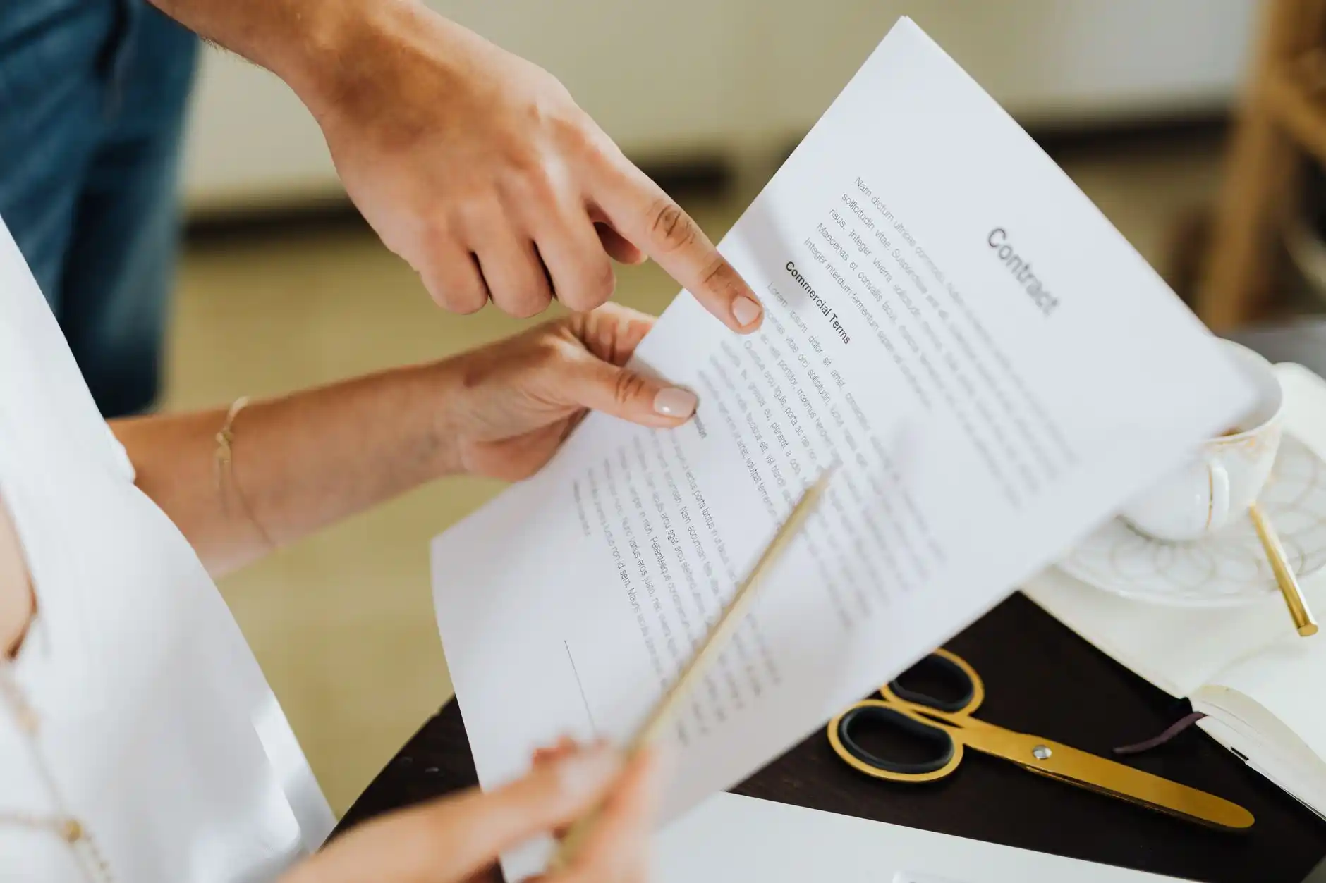 Editorial photograph illustrating "Start With the Contract and Approved Changes" in the context of remodeling punch list, natural daylight, realistic setting, no text or logos i...