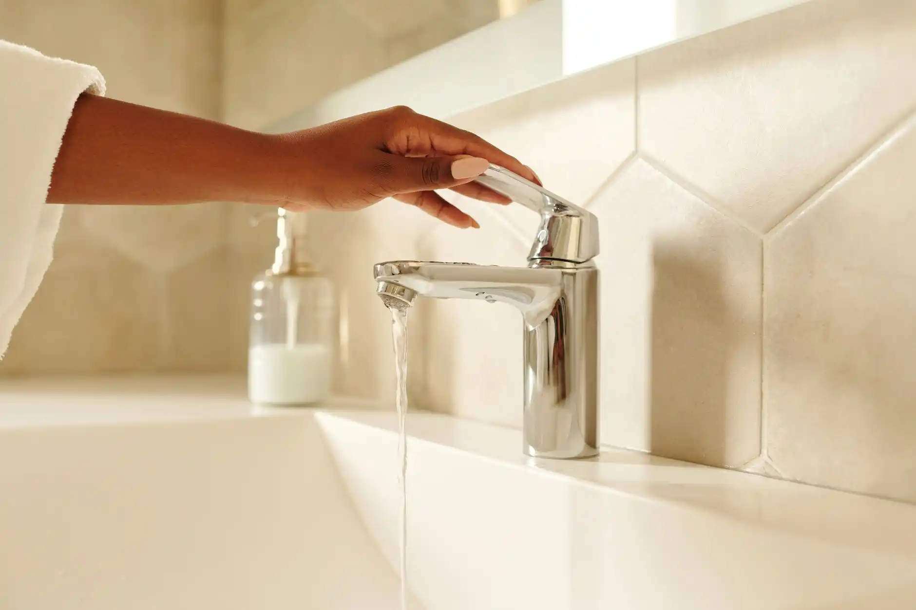 Editorial photograph illustrating "Test Plumbing Fixtures" in the context of remodeling punch list, natural daylight, realistic setting, no text or logos in frame.