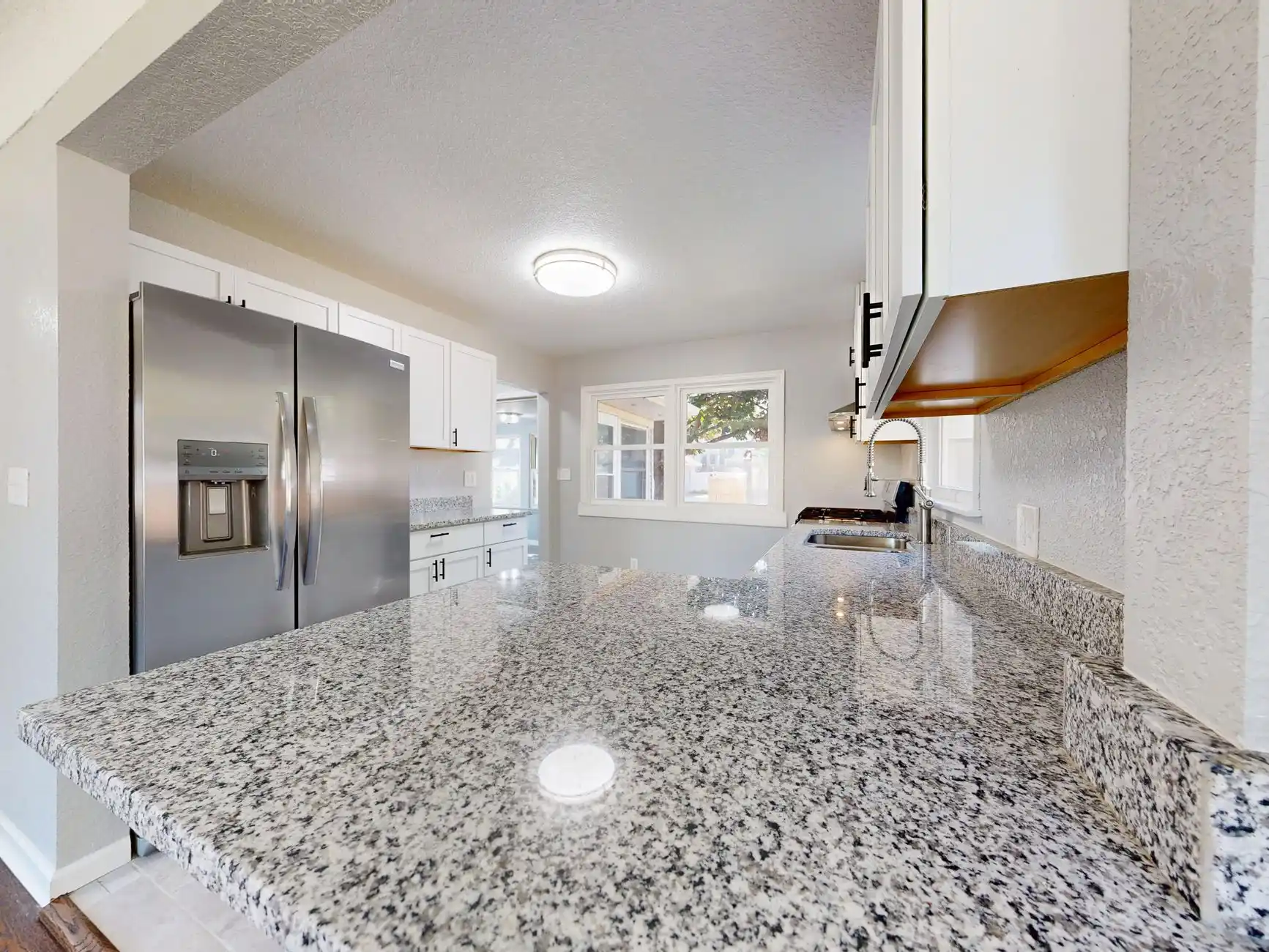 Editorial photograph illustrating "Verify Appliances and Manuals" in the context of remodeling punch list, natural daylight, realistic setting, no text or logos in frame.