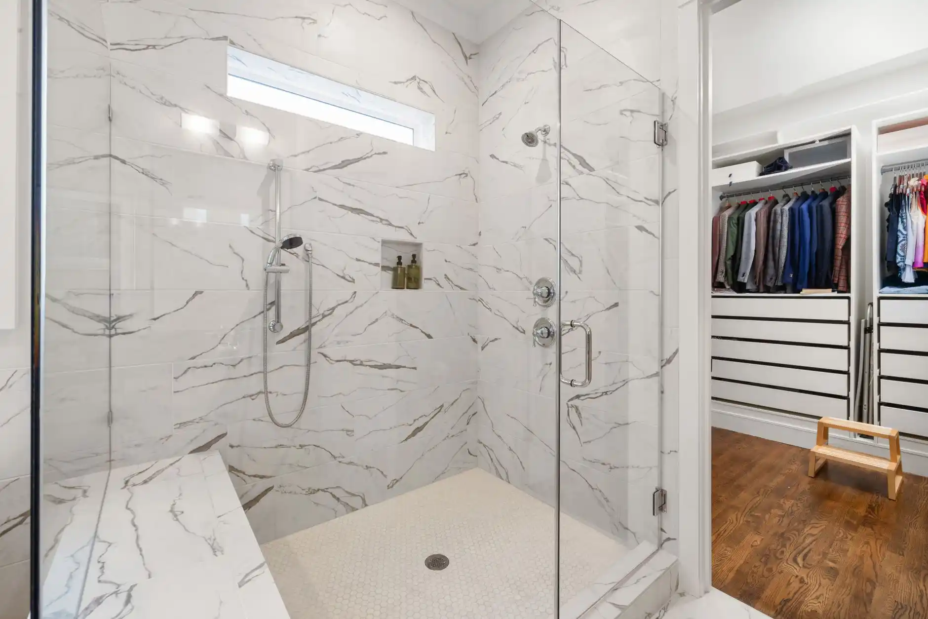 Editorial photograph illustrating "Curbed vs Curbless Shower" in the context of tub to walk-in shower conversion cost, natural daylight, realistic setting, no text or logos in f...