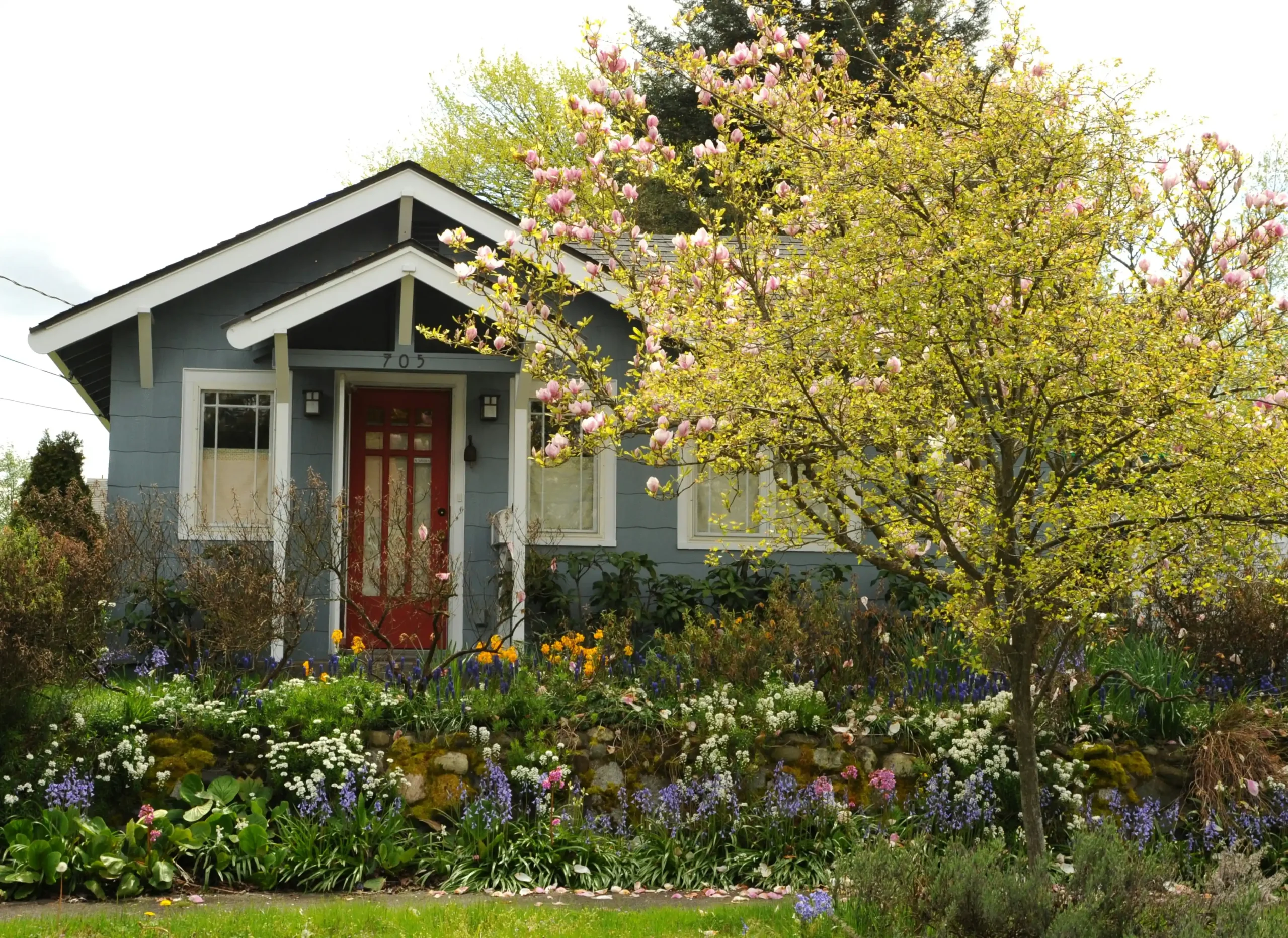 Editorial photograph illustrating "What Is a Realistic Whole House Remodel Budget in Seattle" in the context of whole house remodel cost Seattle, natural daylight, realistic set...