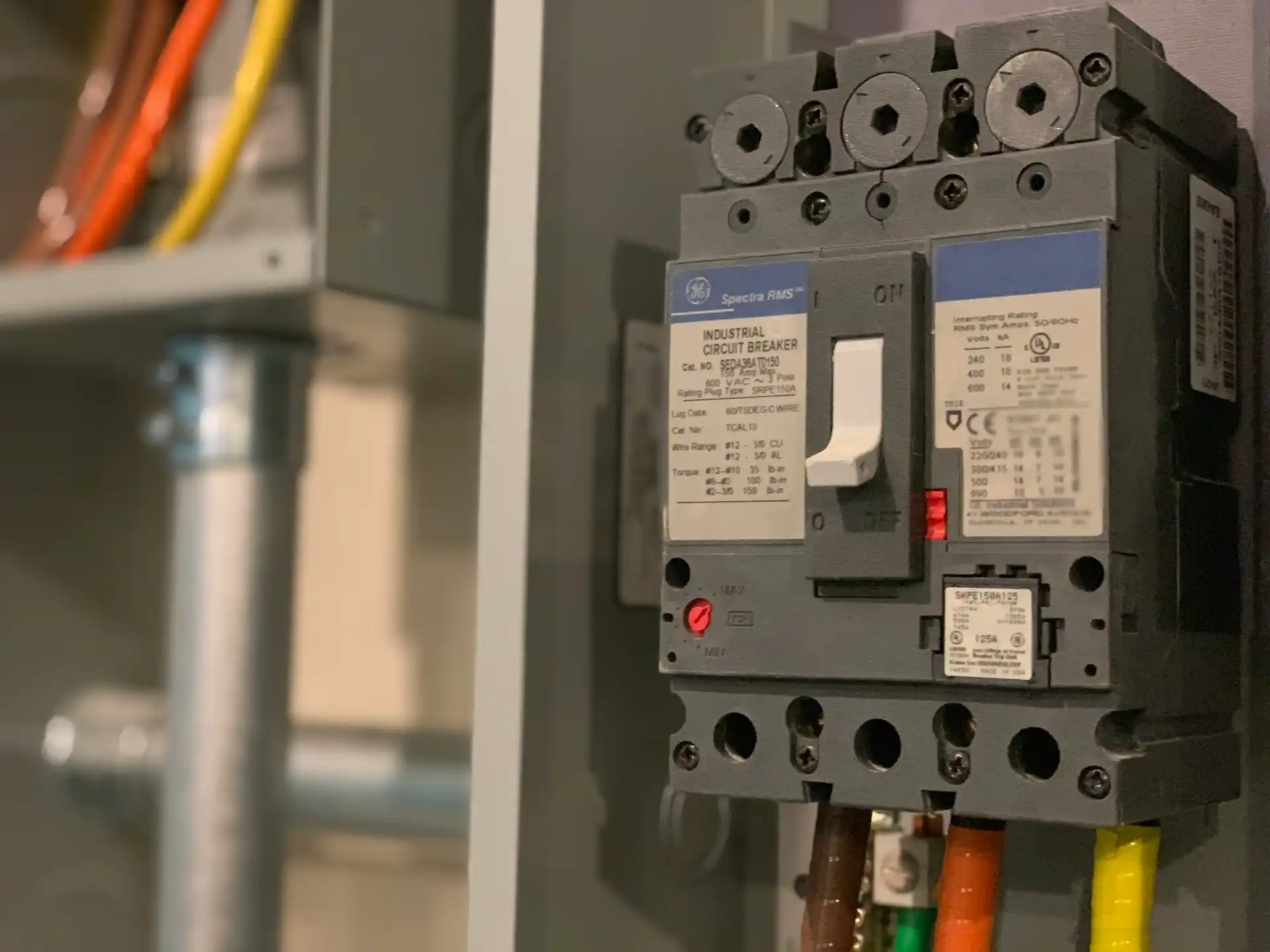 Editorial photograph illustrating "Electrification Can Change the Calculation" in the context of electrical panel upgrade during remodel, natural daylight, realistic setting, no...