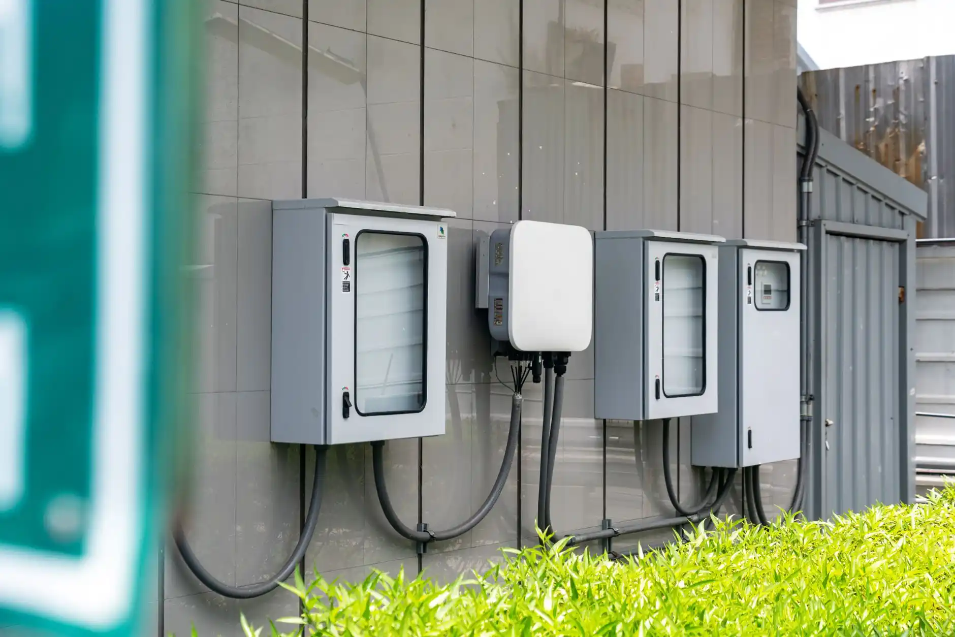 Editorial photograph illustrating "Who Pays for Utility Service Work" in the context of electrical panel upgrade during remodel, natural daylight, realistic setting, no text or ...
