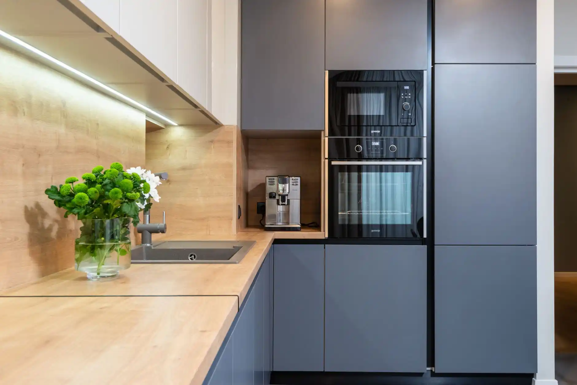 Editorial photograph illustrating "Mixer Lifts" in the context of kitchen storage upgrades, natural daylight, realistic setting, no text or logos in frame.
