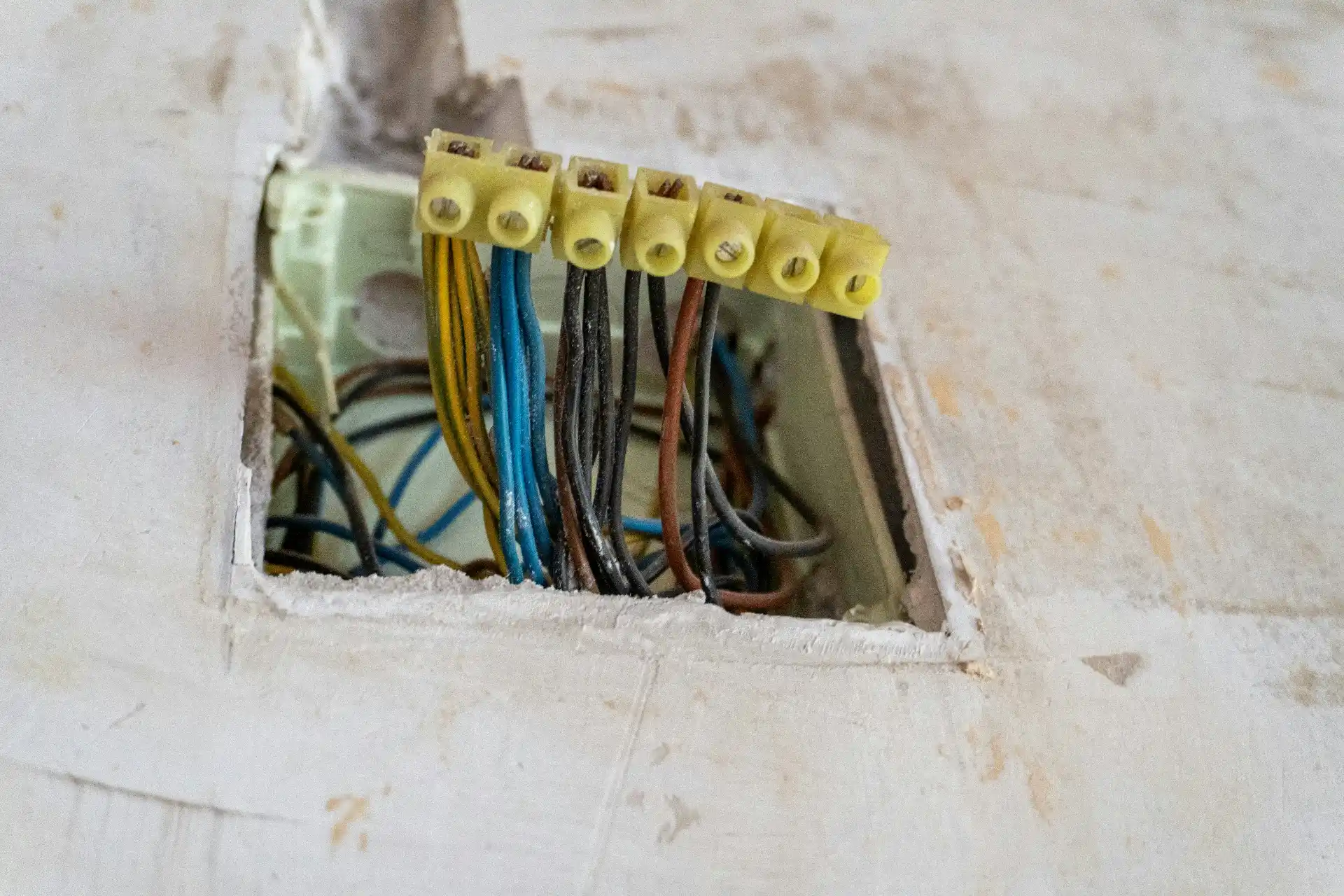 Editorial photograph illustrating "Can Knob-and-Tube Be Connected to New Wiring" in the context of knob and tube wiring remodel, natural daylight, realistic setting, no text or ...