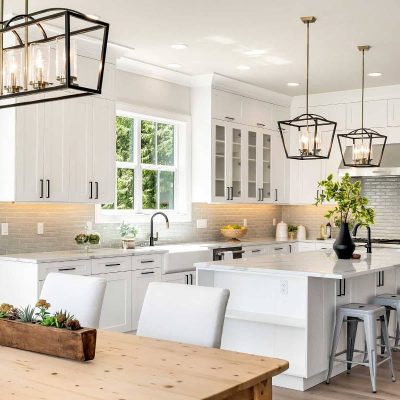 white kitchen with hanging light fixture