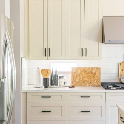 White shaker kitchen remodel with farmhouse sink by United Signature