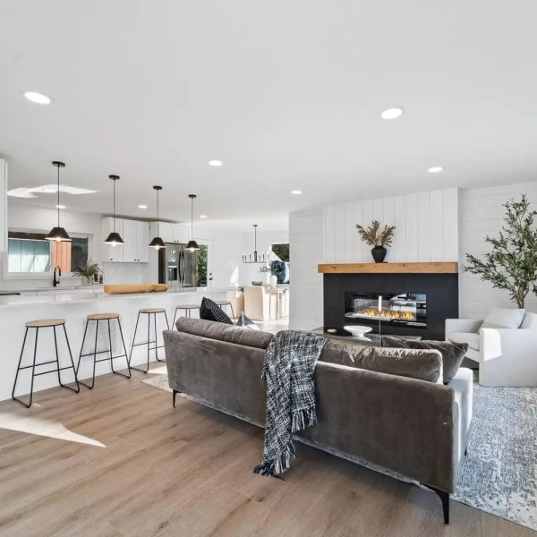 Open-concept living room and kitchen remodel in Seattle by United Signature