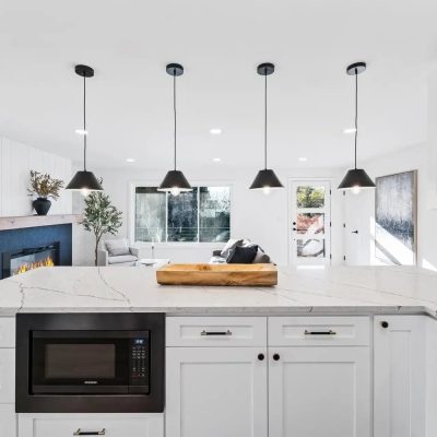 Seattle kitchen remodel with white cabinets and black pendants, United Signature