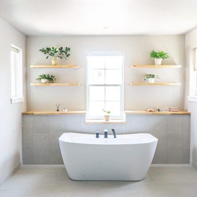 freestanding white tub in bathroom