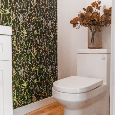 white toilet with wallpaper