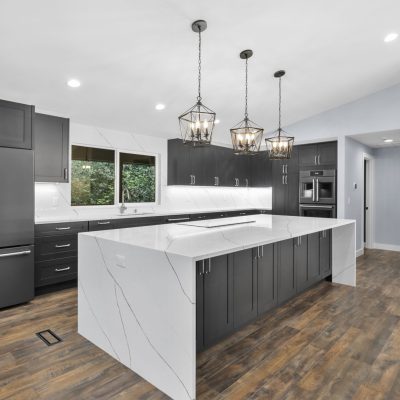 white and black kitchen with wood floors