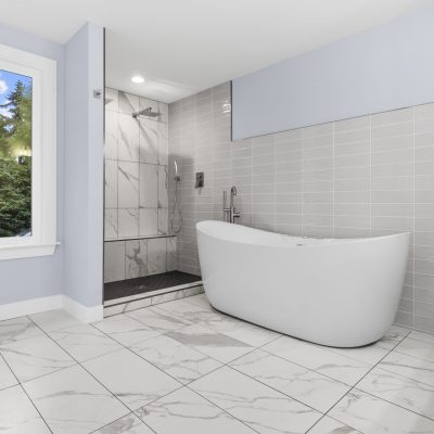 white bathroom with white freestanding tub