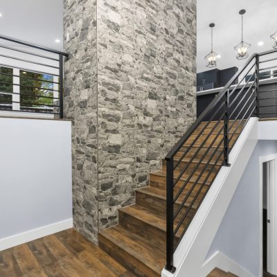 staircase with stone pillar in home