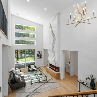 living room with white walls and lighting fixture